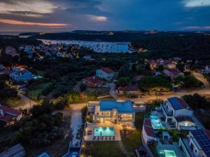 an aerial view of a city at night at Villa 7Eight Banjole in Banjole