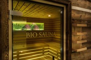 a sign on the door of aizuarmaarmaarmaarmaarmaarmaarmaarma at Hotel La Fradora - Dolomites Hotel in San Cassiano