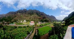 a view of a mountain from a house at ROMANA guest house in Tarrafal da Vila de Ribeira Grande