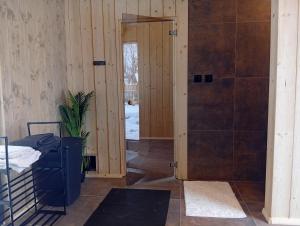 a bathroom with a shower and a door to a room at Bobrí potôčik in Liptovský Mikuláš +125 photos