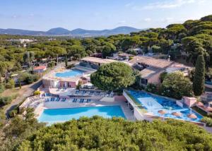an aerial view of a resort with two pools at St Tropez Surprise in Gassin