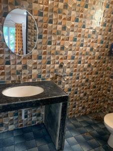 a bathroom with a sink and a mirror at Aasra Studios in Agonda +17 photos