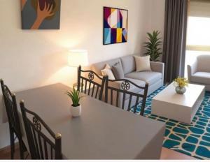 a living room with a table and a couch at Montrebei Casa González Apartamentos in Tolva +48 photos