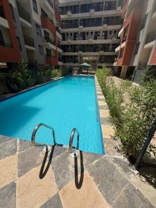 a swimming pool in the middle of a building at Solara Loft in Nairobi