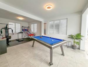a room with a pool table and a gym at Isabela Luxury Escape sky view in Isabela