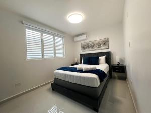 a bedroom with a large bed with a window at Isabela Luxury Escape sky view in Isabela
