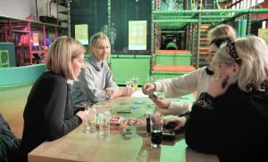 a group of women sitting around a table playing cards at Der schöne Asten - Resort Winterberg in Winterberg +95 photos