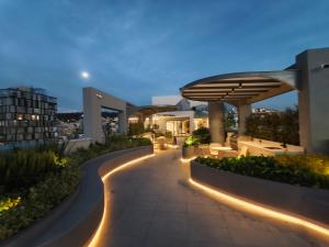 a night view of a building with lights on it at Adagio Quito Coliving Ecuador Residences in Quito