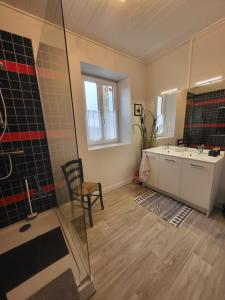 a bathroom with a shower and a sink at Au doux refuge in Saint-Exupéry-les-Roches +13 photos