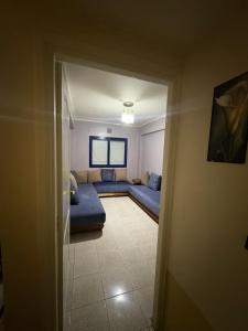 a view of a living room with a couch at Palm Beach in Mansouria