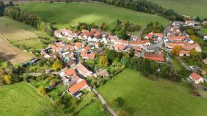an aerial view of a small village with red roofs at Chalupa U Dudáčků in Volyně