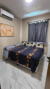 a bedroom with a bed in a room at Casa veraneio2 in Camacari +8 photos