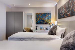 Ένα ή περισσότερα κρεβάτια σε δωμάτιο στο Hotel 55