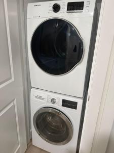 a white washer and dryer in a room at 2 Bedrooms Private EntRance wifi Free Parking in Prince George