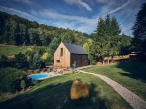 an overhead view of a barn with a pool at Chalet Plechovka in Frýdštejn