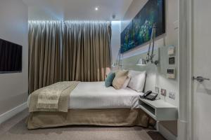 Ένα ή περισσότερα κρεβάτια σε δωμάτιο στο Hotel 55