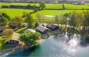 an aerial view of a house on a river at Swanmere lodge, Lakeside view Pinelake Carnforth in Carnforth