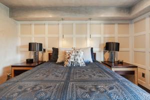 a bedroom with a large bed with two lamps at Luxury Condo Resort Amenities - Pool, Pickleball in San Diego +36 photos