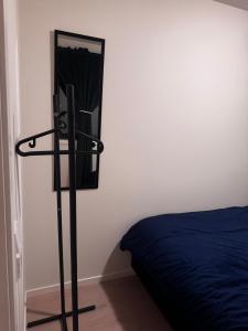 a bedroom with a bed and a mirror on the wall at Modern Flat In Flateby, Enebakk in Flateby
