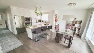 a kitchen with a table and chairs in a room at Richview Gardens Suite, 3-bdr in Toronto +7 photos