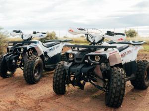 two atvs are parked on a dirt road at Kwagae farm in Kuruman +6 photos
