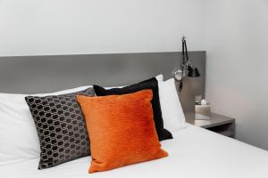 Ένα ή περισσότερα κρεβάτια σε δωμάτιο στο Hotel 55