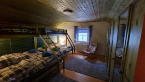 an overhead view of a bedroom with bunk beds at Prázdninový dům u Špičáku in Albrechtice v Jizerských horách