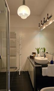 a bathroom with a sink and a mirror at Residence Casa del Moro in Minerbio +51 photos