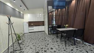 a kitchen and dining room with a table and chairs at Villa Dacha in Izmail