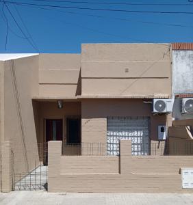 a house is being built with a fence at Casa Esmeralda in Concordia