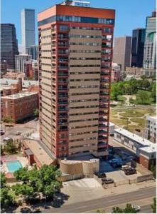 a tall building in a large city with buildings at Comfortable 1 Bed 1 Bath Loft in Uptown Denver in Denver