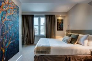 Ένα ή περισσότερα κρεβάτια σε δωμάτιο στο Hotel 55