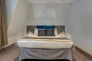 Ένα ή περισσότερα κρεβάτια σε δωμάτιο στο Hotel 55