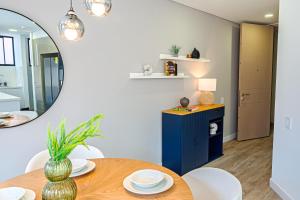 a dining room with a table and a mirror at Hotel EspacioYa By Mario Rental 103 in Bogotá +152 photos
