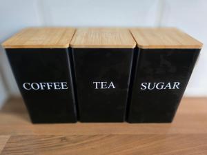 three black books sitting on top of a wooden table at Magic Stays! in Halton +5 photos