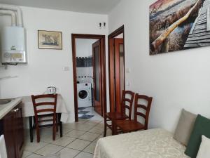 a kitchen with a table and chairs in a room at Margherita in Seriate