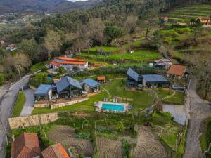 an aerial view of a house on a hill at Casas De Bouro 3 Casa Do Alecrim in Terras de Bouro