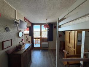 a room with a bunk bed and a room with a desk at Studio La Plagne Villages in La Plagne Tarentaise