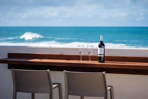 a table with two glasses and a bottle of wine at Terregal in Ajuy +42 photos
