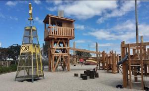 a playground with a wooden play structure and a tower at Splendid Spacious - Port Melbourne Beachside Home in Melbourne
