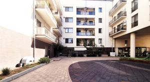 an empty courtyard in front of a building at Bucharest Central E Apartment in Bucharest