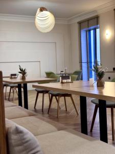 a room with tables and chairs and a whiteboard at Château Byurakan Hotel in Byurakan