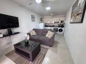 a living room with a couch and a coffee table at Lantana 8 in Saint James