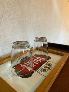 a glass vase sitting on a wooden table at Incanto in Niterói