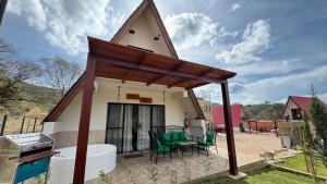 a small house with a pitched roof at VERONA Cabañas in Samaipata