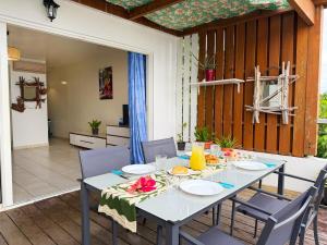 a table with plates of food on it on a patio at Large studio facing lagoon in Bora Bora +30 photos