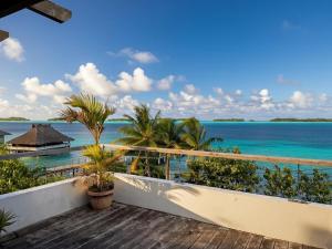 a view of the ocean from the balcony of a resort at Large studio facing lagoon in Bora Bora