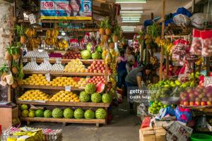 a market with fruits and vegetables in a store at Casa B Pasco in Dauin