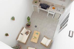 an overhead view of a room with a table and a kitchen at Casa La Pedrera in Pedralba