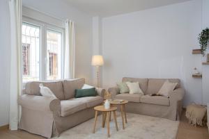 a living room with a couch and a table at Casa La Pedrera in Pedralba